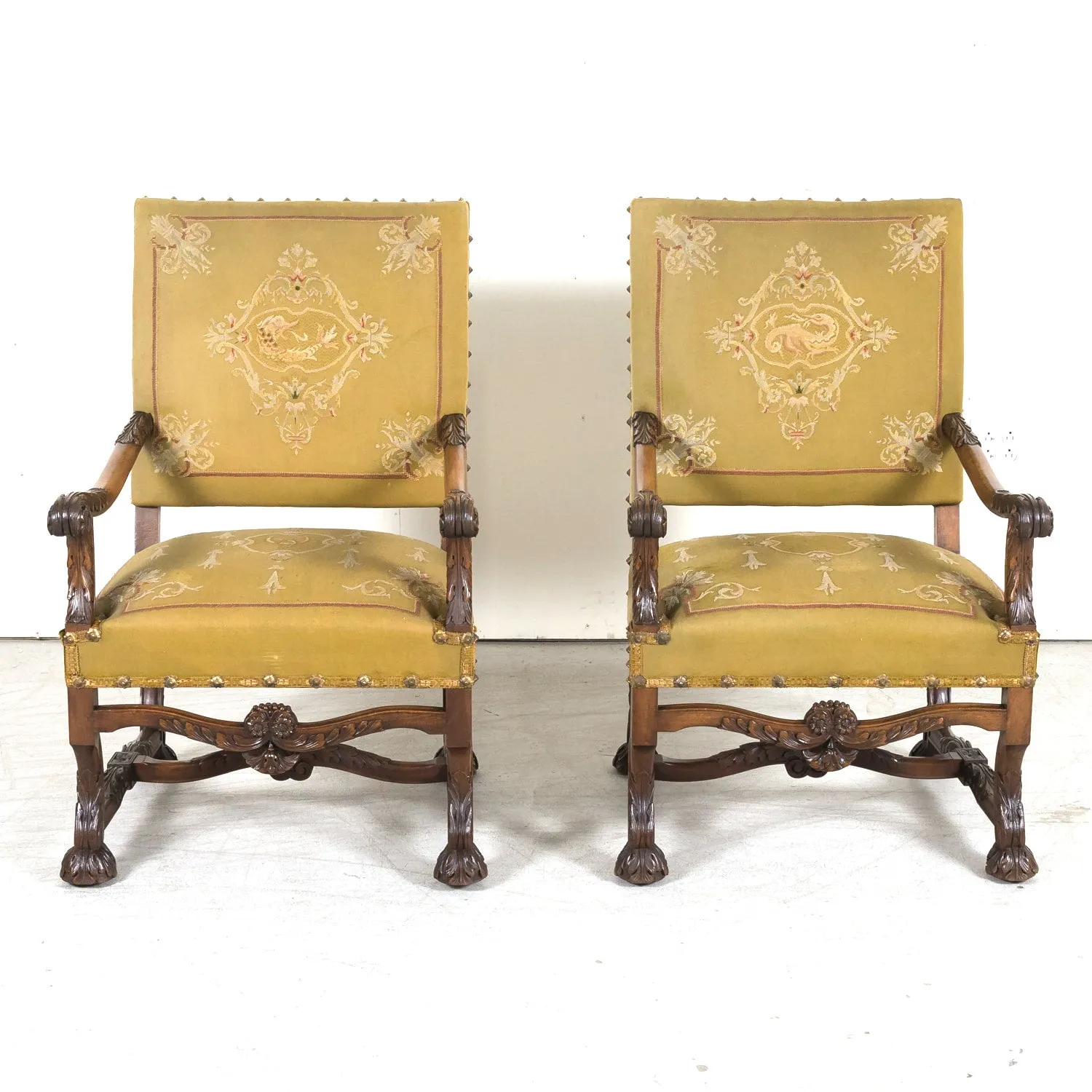 Pair of Early 19th Century French Louis XIV Style Carved Walnut Fauteuils or Armchairs